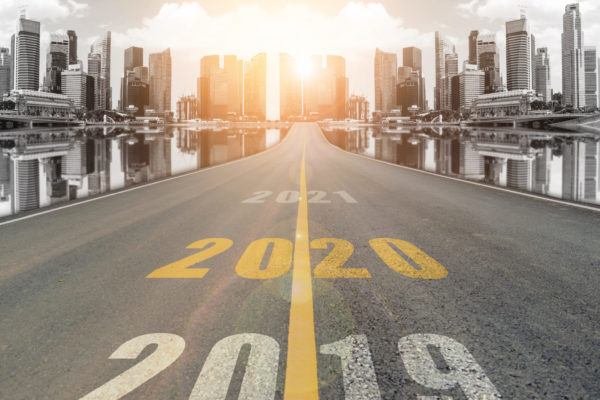 Road leading to city with years 2019, 2020, and 2020